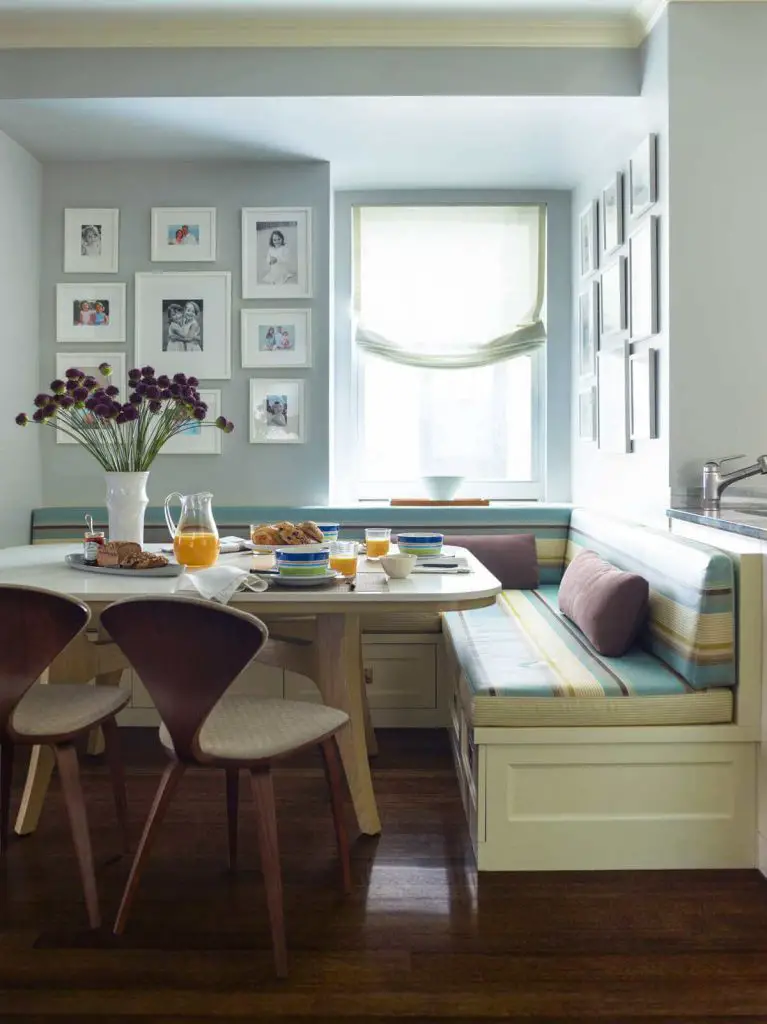 A combination of Benjamin Moore paints — Green Tint for the banquette and Silver Marlin for the walls — creates a soothing palette in this kitchen on Manhattan’s Upper East Side