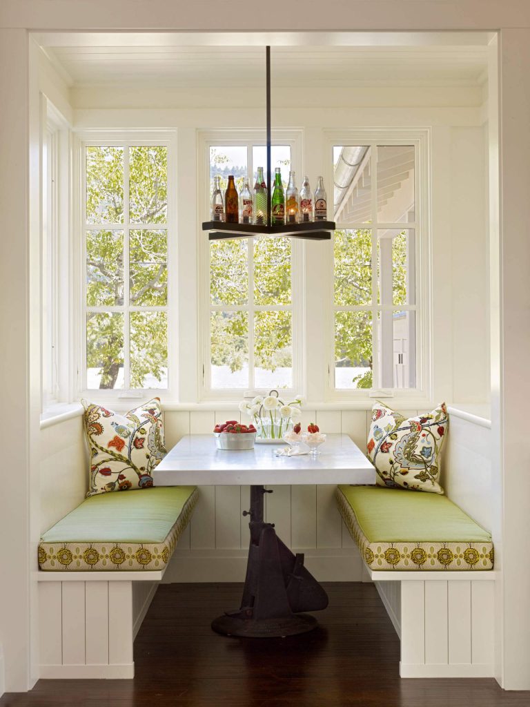 A custom chandelier made from old glass soda bottles makes a fun statement in this Calistoga, California, farmhouse kitchen