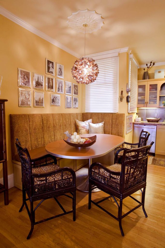 A fresh coat of Creamy Apricot paint from Dunn Edwards makes for a warm scene in this San Francisco kitchen, set aglow by the Lotus Flower chandelier.