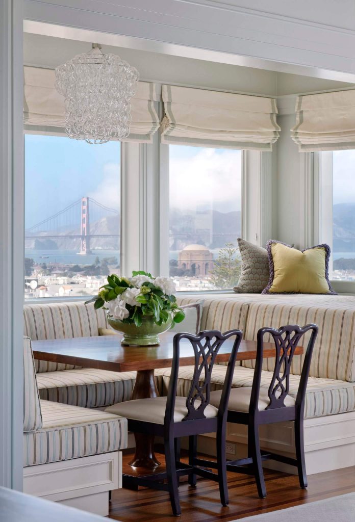 Brentano Fabrics’ Festive Stripe fabric covers the banquette of this San Francisco kitchen nook with incredible views of the Golden Gate Bridge.