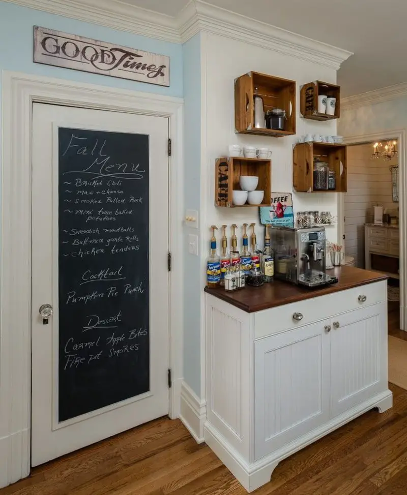 Emery Design & Woodwork turned vintage coffee crates into wall shelves by hanging them above the coffee station in this Detroit kitchen.