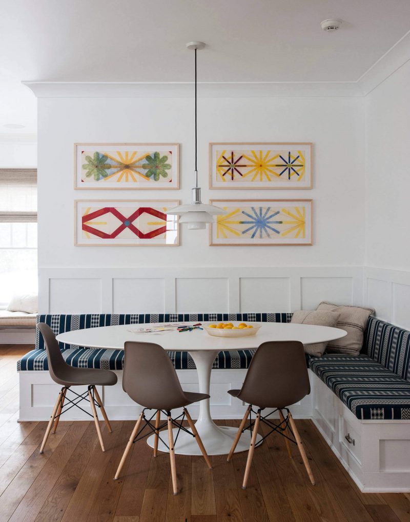 Colorful artwork found at Kenise Barnes Fine Art blends well with the modern furnishings of this kitchen area in Auckland, New Zealand