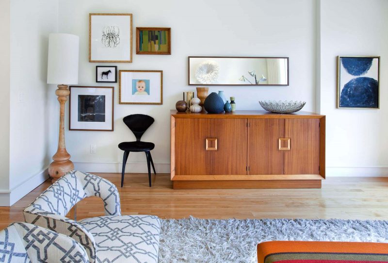 Danish light wood floor living room photo in Toronto with white walls