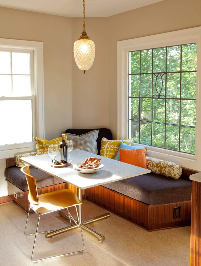 Designer Robin Rigby Fisher removed the top of a vintage chrome table and replaced it with marble in this transitional Portland, Oregon, kitchen nook.