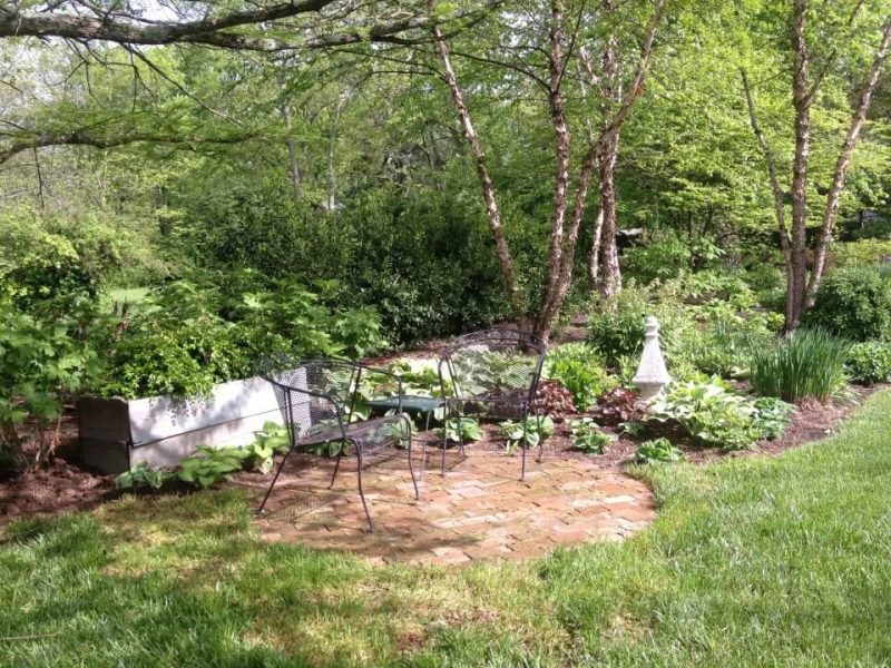 Example of a small classic backyard brick patio design in Other