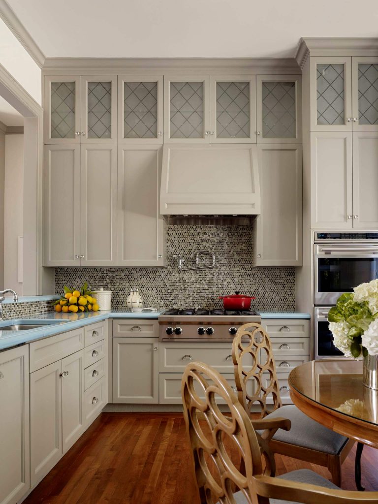 Example of a trendy kitchen design in San Francisco with mosaic tile backsplash, stainless steel appliances and turquoise countertops