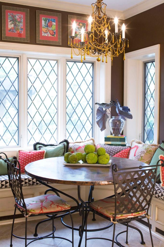 Interior designer Joni Spear paired a 42 inch copper table from Arhaus and a chandelier dripping with golden beads for this St. Louis kitchen corner.