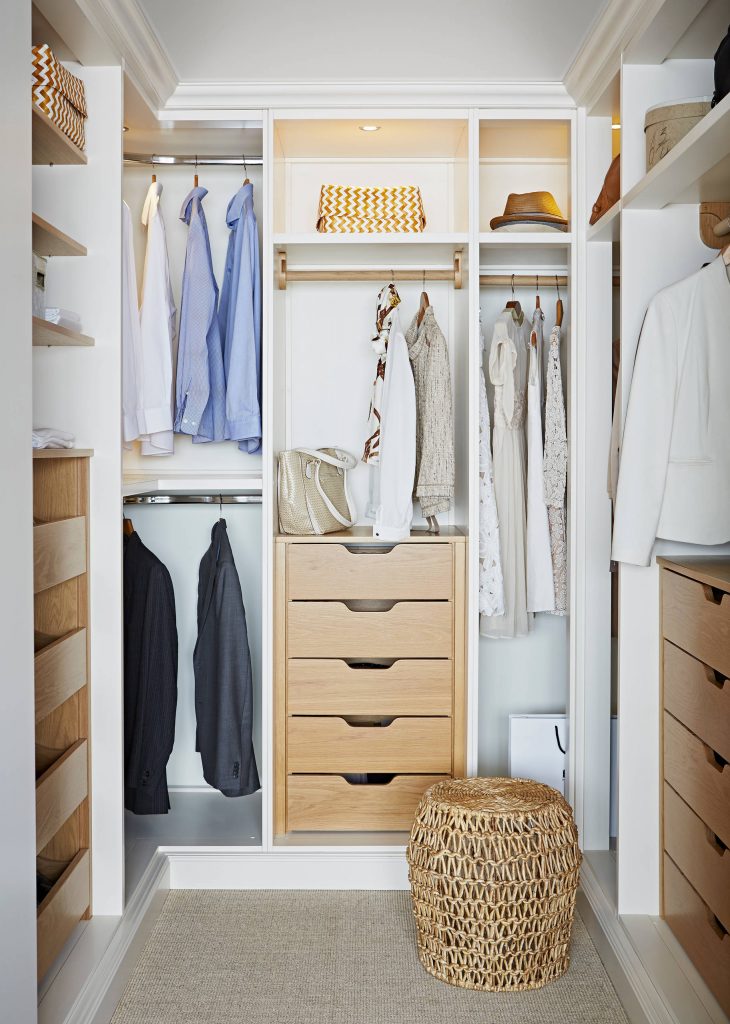 Most popular closet (2) White and wood is a popular combination, and this closet shows why. Oak drawers contrast crisp white cabinetry and complement the natural texture of the footstool. This closet is about 10 feet long and 8 feet wide.