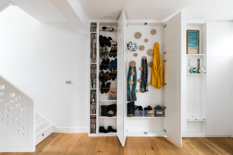 Most popular closet (3) Sure, closets are important for storing clothes in the bedroom, but storage for all rooms is essential. In this London home, a built-in closet helps define the boundary of the living room while also storing shoes, clothes and CDs. Racks and hooks provide flexibility and ease while still maintaining order.