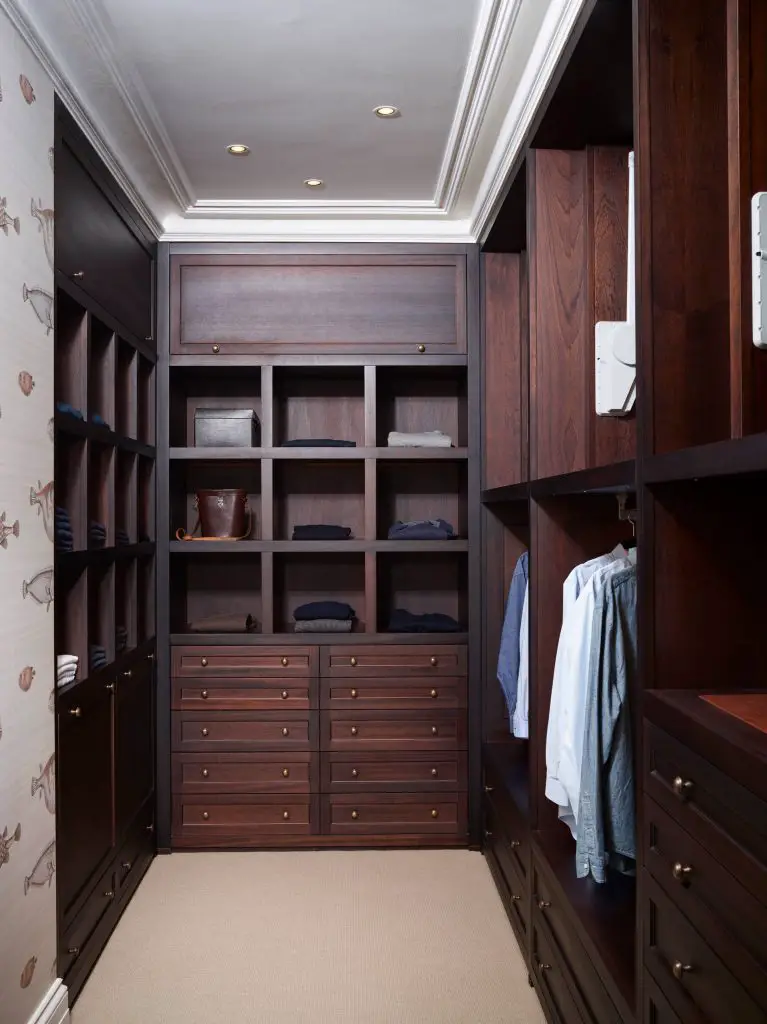 Most popular closet (4) In contrast to the previous closet space, this one has been done in rich, dark wood. Instead of cabinets and lots of hanging rods, it features open storage cubbies for folded clothes and accessories.