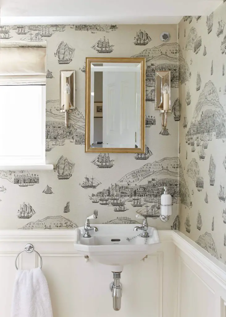 Located in a former church in England, this powder room designed by Etons of Bath keeps a sense of historic character with its vintage-inspired wallpaper and Industrial Age-style sink.