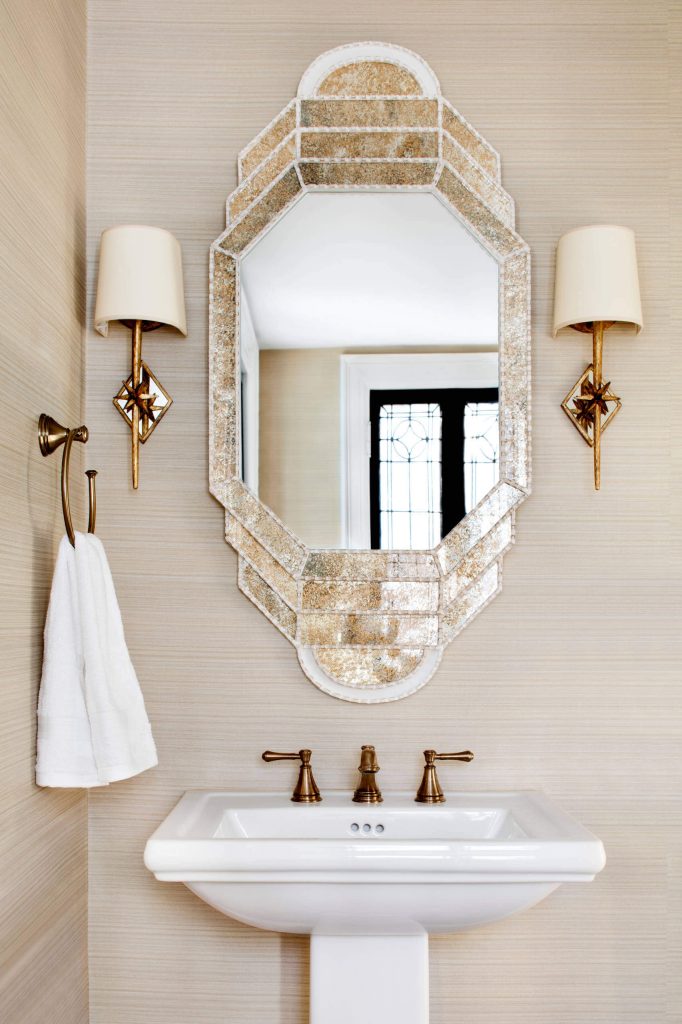 A beige-and-brass palette makes for a serene yet sophisticated powder room in Baltimore. This stylish space was created by designer Stephanie Bradshaw.