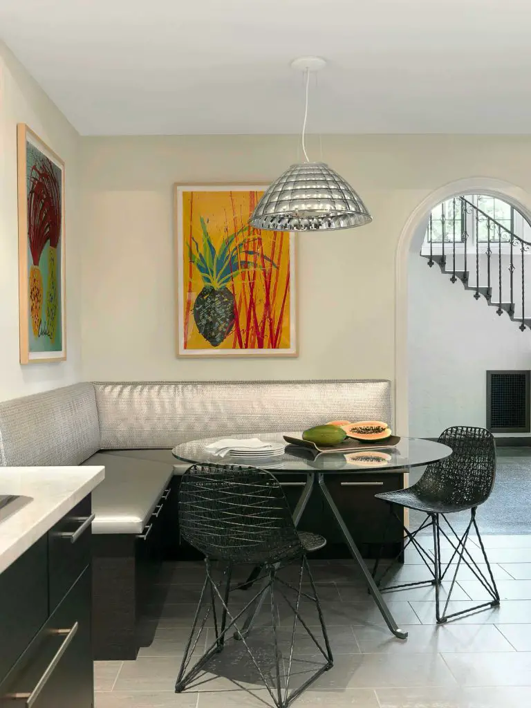 Silver is the star of this St. Louis breakfast nook. It covers the banquette and sparkles above in the Starglass pendant