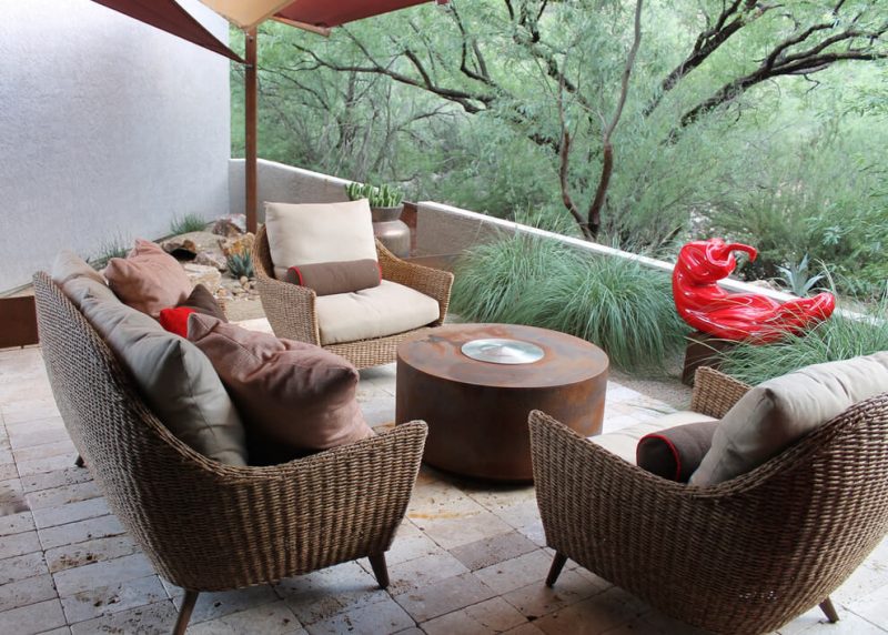 Small minimalist backyard stone patio photo in Phoenix with an awning