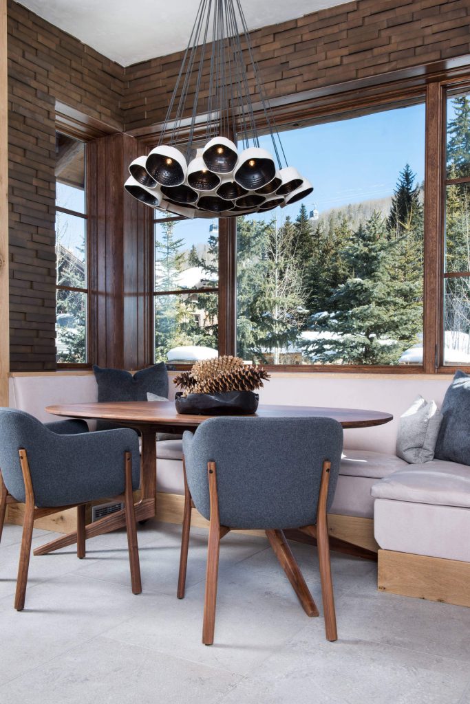 Snowy outlooks and brick walls make for a rustic yet modern look in this Vail, Colorado, kitchen nook