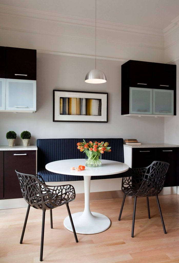 The Forest Garden chair and Docksta dining table are highlights of this modern breakfast nook in Boston