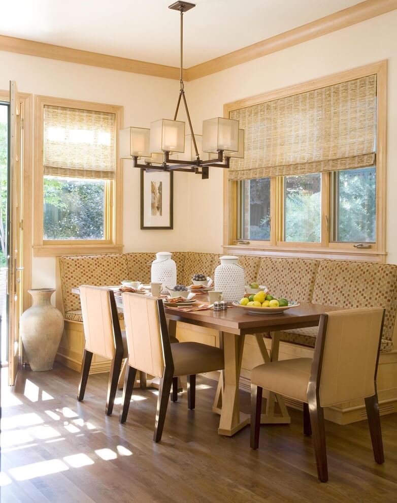 The Pocci Design Group created this cream toned kitchen eating area that features a custom made chandelier from Fine Art Lamps