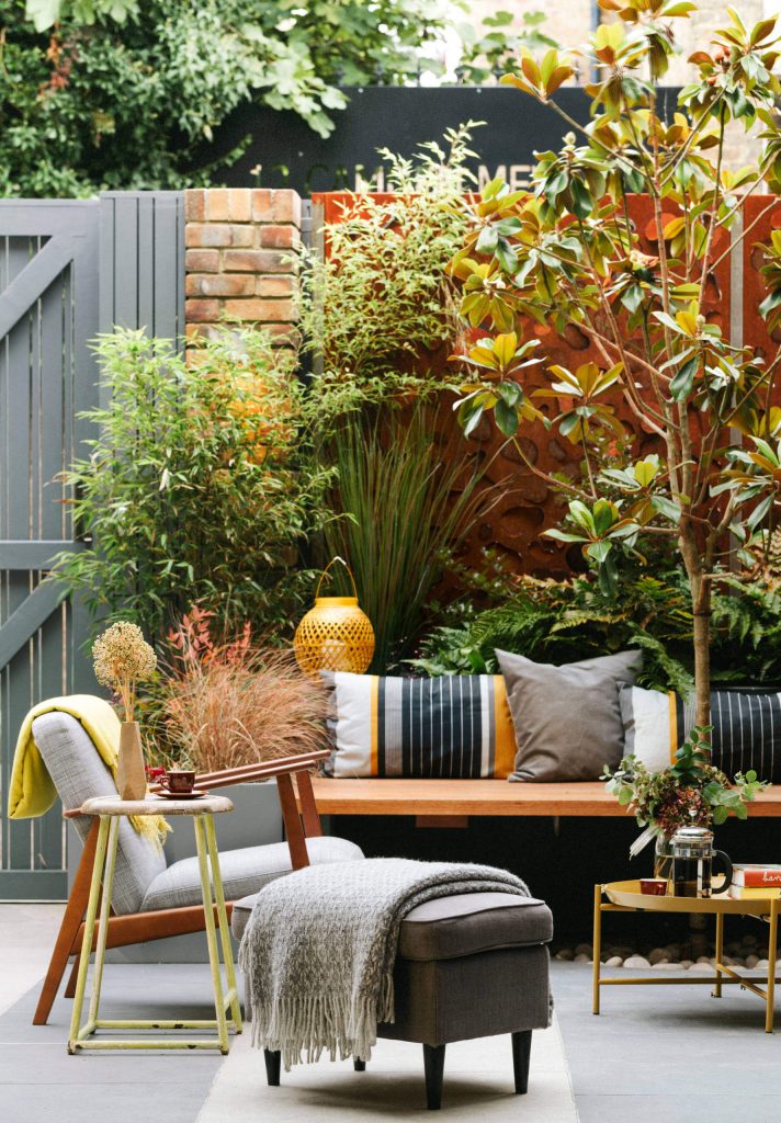 The bifold doors open directly onto this seating area creating a seamless flow from interior to exterior.