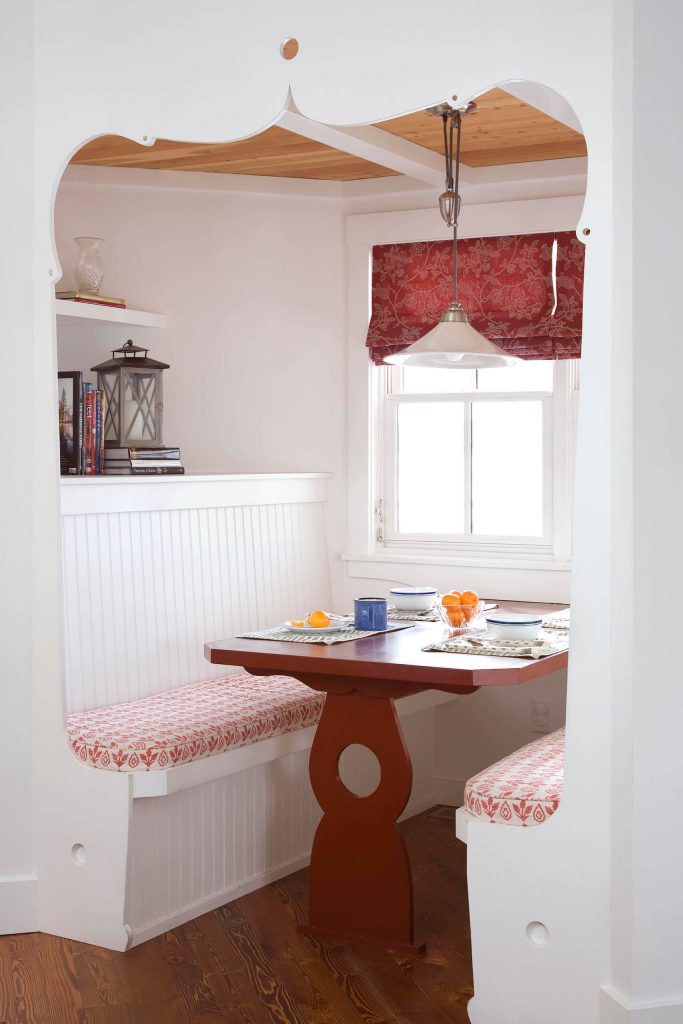 The fine woodwork details make this custom booth designed by Goff Architecture a special place for breakfast