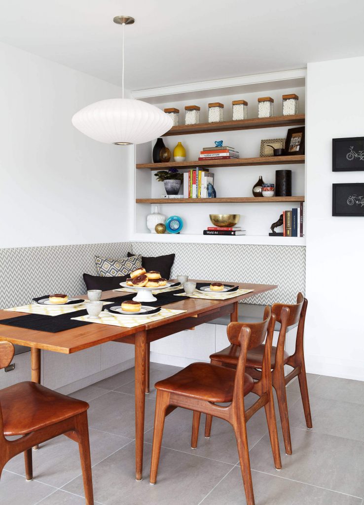 The style makers at Services Rendered Interior Design used a vintage table and chairs to complete this Toronto kitchen eating area