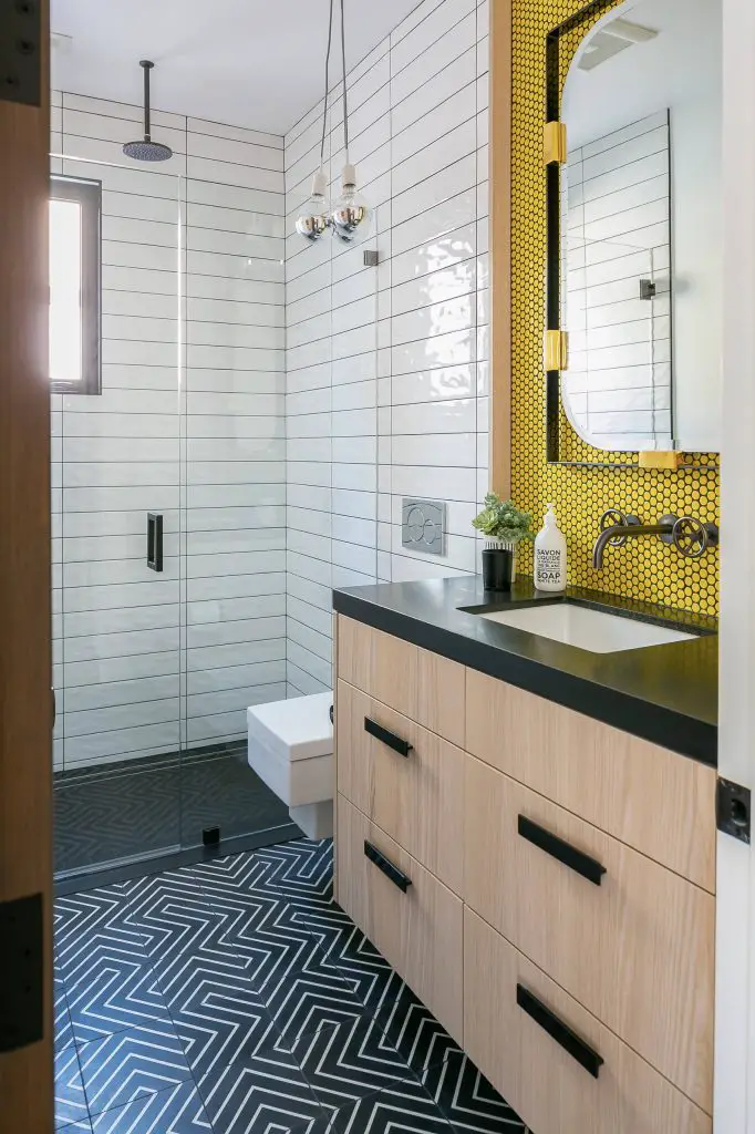 white tile, yellow tile and mosaic tile black floor walk in shower