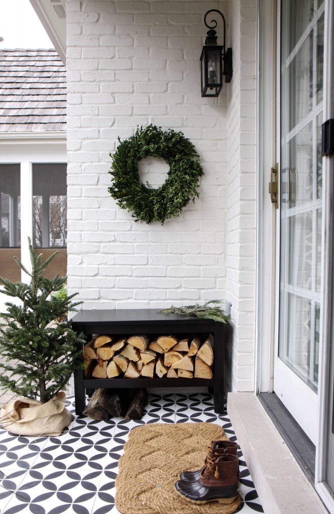 A door that can handle a wreath (like these glass sliders), try placing the wreath to the side, like we see in this pretty, wintry tableau.