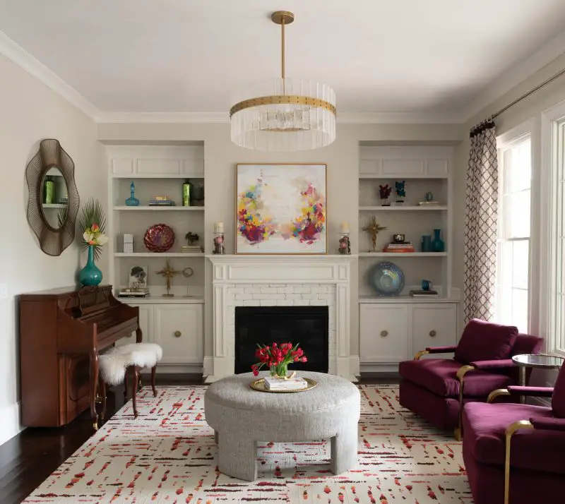 A similar burgundy on the upholstered chairs in this North Carolina living room by designer Brooke Cole