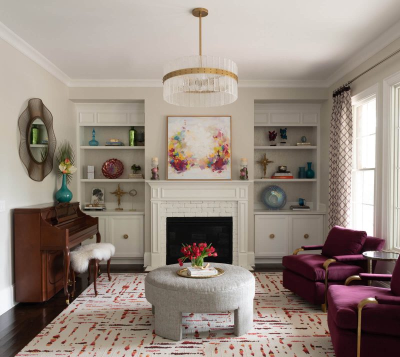 A similar burgundy on the upholstered chairs in this North Carolina living room by designer Brooke Cole