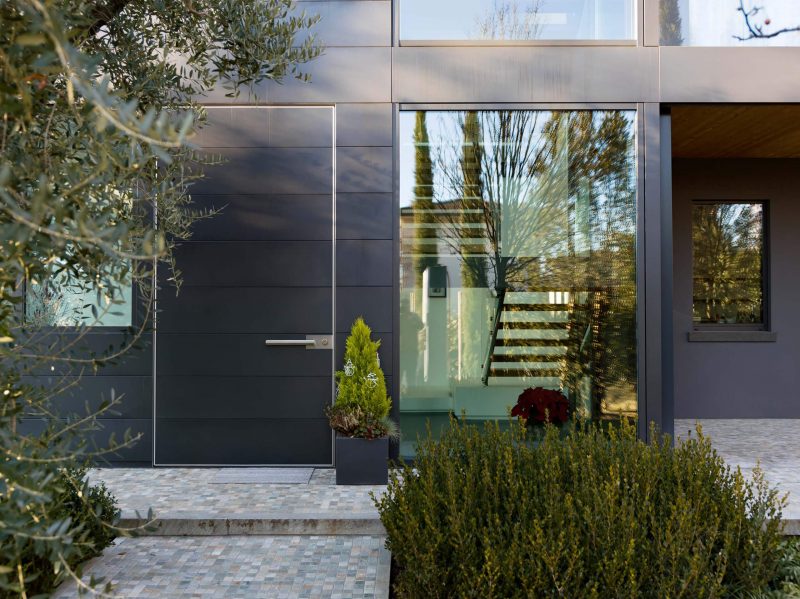 A smooth black exterior and front door create a striking look.