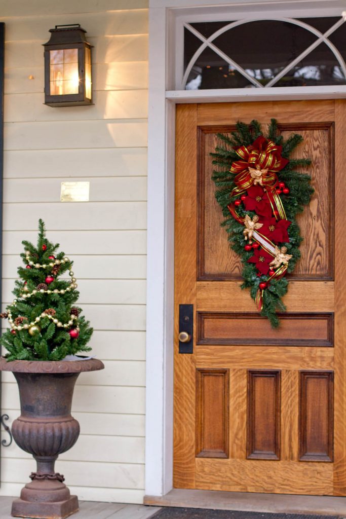 Decorating small evergreens in outdoor planters like Christmas trees is always fun.