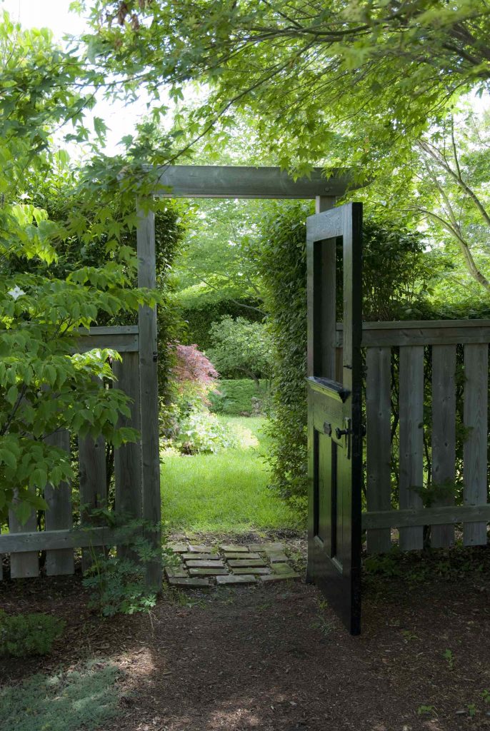 The door to this Toronto garden was the original front door to the property’s 1928 house.