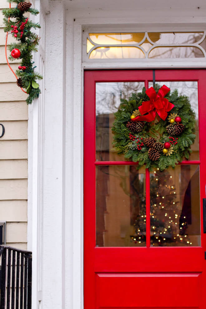 This beautiful front door allows a peek through to the tree inside.