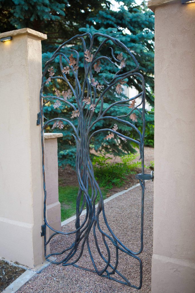 This custom bronze garden gate has an oak tree design