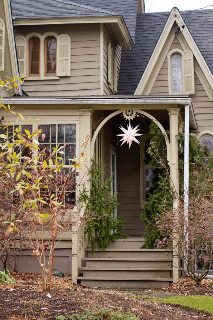 This door isn’t visible from the street, so a beautiful star hanging from the porch marks the season instead.