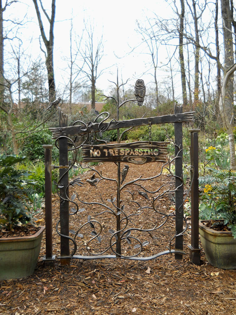 This foreboding custom iron garden gate in Atlanta was designed