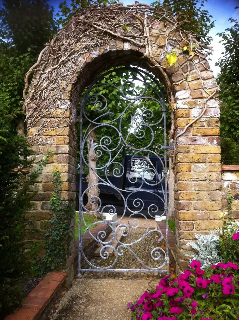 This garden gate in London, designed by Adrian Payne, is made of hand forged, acid etched iron.