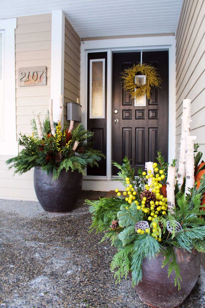 Unexpected chartreuse and yellow berries rev up this entry’s decorations.