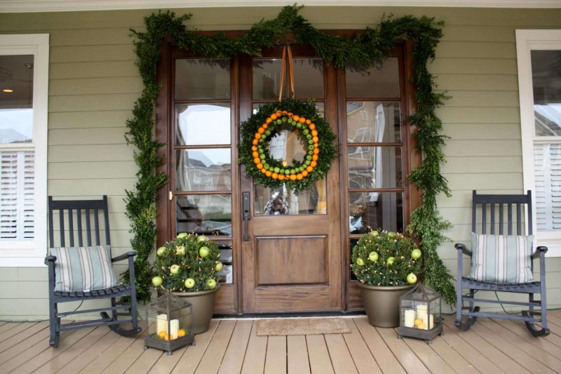 Classic front porch idea in Nashville with decking and a roof extension